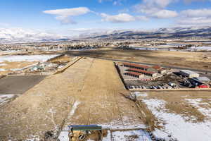 Snowy aerial view featuring a mountain view