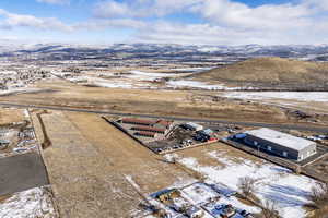 Snowy aerial view with a mountain view