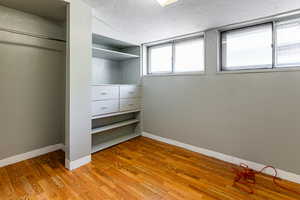 Walk in closet featuring light hardwood / wood-style floors