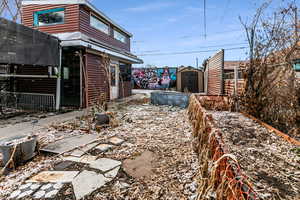 View of yard with a storage unit