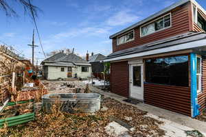 Back of property featuring an outbuilding