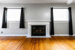 Unfurnished living room with wood-type flooring