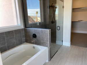 Bathroom featuring plus walk in shower