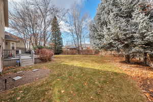 View of yard with a deck