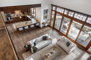 Living room featuring dark hardwood / wood-style flooring and sink