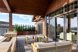 Wooden terrace with an outdoor hangout area