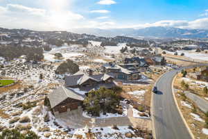 Snowy aerial view featuring a mountain view