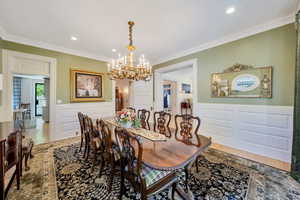 Gorgeous chandelier and original molding.