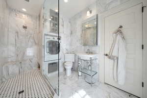 Bathroom with washer / clothes dryer, a marble shower, newly renovated