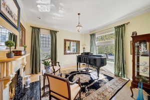 Interior space with light hardwoodfloors, ornamental molding,