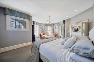 Primary Bedroom with onsuit, sitting area, walkout porch and fireplace.