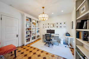 Flex space with built in cabinetry, original wood flooring and great closet space.