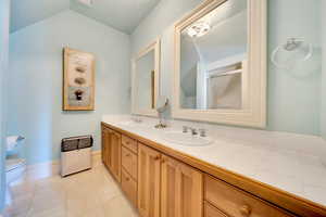 Bathroom with tile patterned flooring, tub/shower