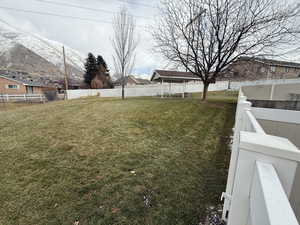 View of yard with a mountain view and a trampoline