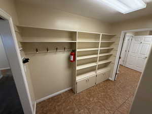 Mudroom with a textured ceiling