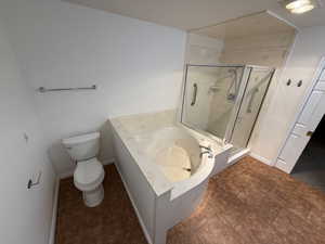 Bathroom with plus walk in shower and toilet