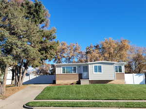 View of front of property with a front yard