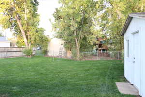 View of yard with a storage shed