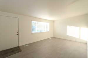 Spare room featuring hardwood / wood-style flooring