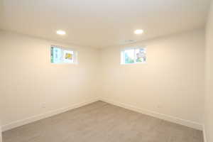 Basement featuring light hardwood / wood-style floors