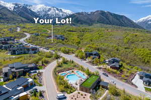 Birds eye view of property with a mountain view