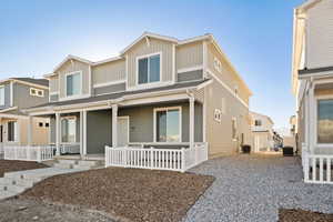 View of front of house with central AC unit and covered porch