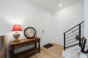 Entrance foyer featuring light wood-type flooring