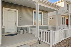 Property entrance featuring covered porch