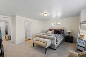 Primary bedroom featuring east views, ample natural light, primary en-suite and walk-in closet