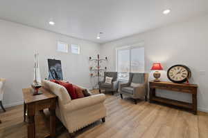 Living room featuring a wealth of natural light and light hardwood / wood-style floors