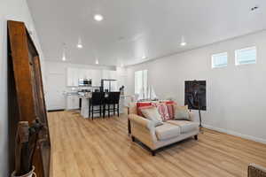 Living room with light wood-type flooring