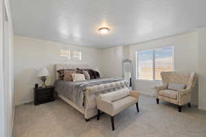 Primary bedroom featuring east views, ample natural light, primary en-suite and walk-in closet