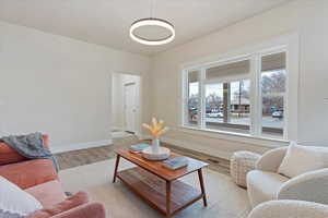 Living room with light wood-type flooring