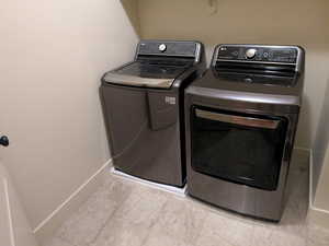 Clothes washing area with washer and clothes dryer