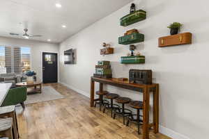 Foyer with light wood-type flooring and ceiling fan