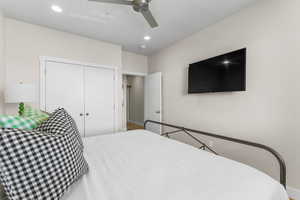 Bedroom featuring a closet and ceiling fan