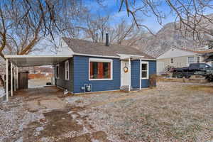 Bungalow featuring a mountain view and a carport