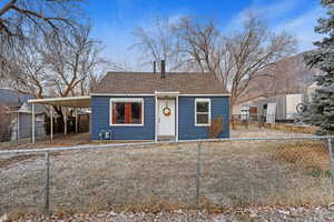 View of front of property with a carport