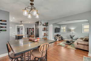 Dining area featuring a chandelier and hardwood / wood-style flooring