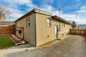 View of side of property featuring a patio area