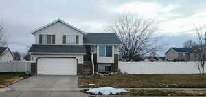 Split level home featuring a garage