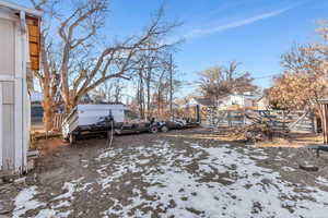 View of yard layered in snow