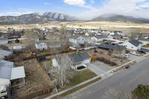 Birds eye view of property with a mountain view