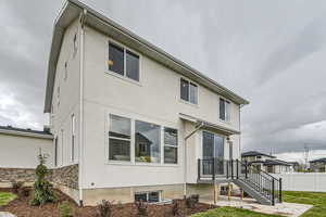 Back of property featuring a patio area