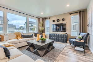 Living room with plenty of natural light and LVP flooring