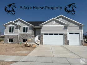 View of front of home featuring a garage