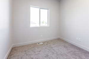 View of carpeted spare room