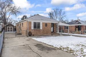 View of front of house with a storage unit