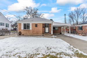 View of front of house featuring a carport