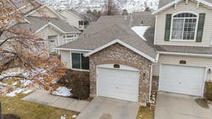 View of front facade featuring a garage